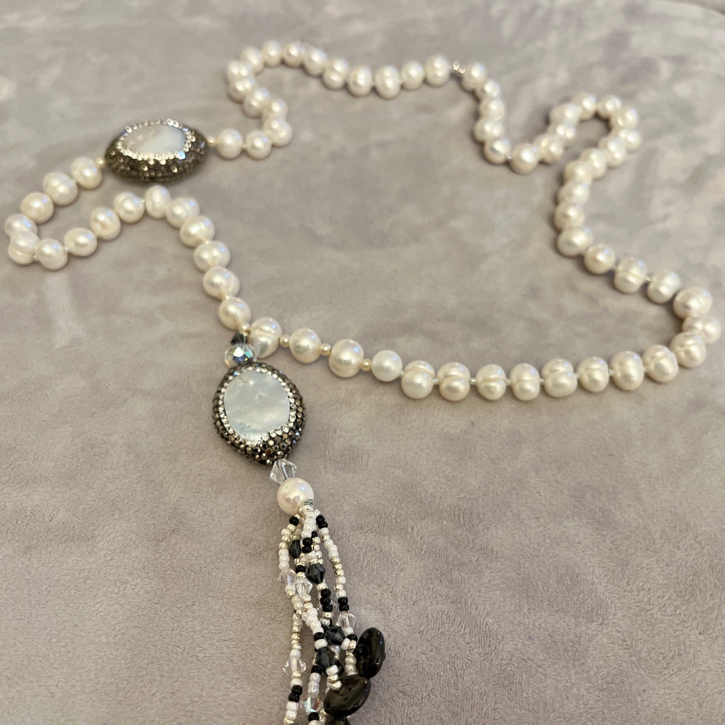 Pearl  with elements in  Mother of Pearl surrounded by crystals